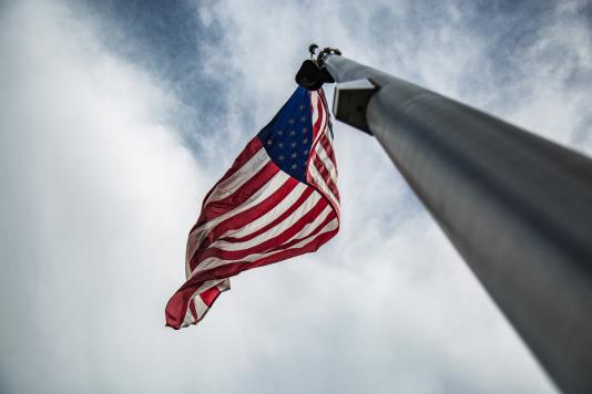 A flagpole with the United States flag 