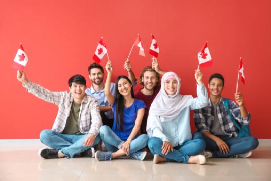 People holding Canadian flags